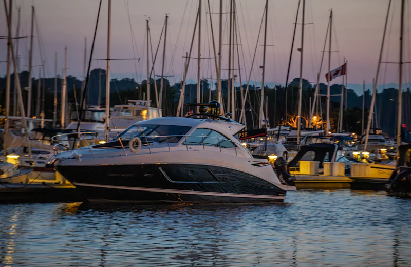 Motor boat moored in a marina at dusk